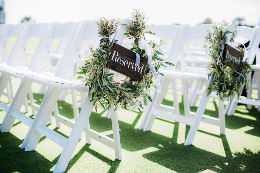 Reserved seats at the wedding on the croquet lawn of the BHI Club.