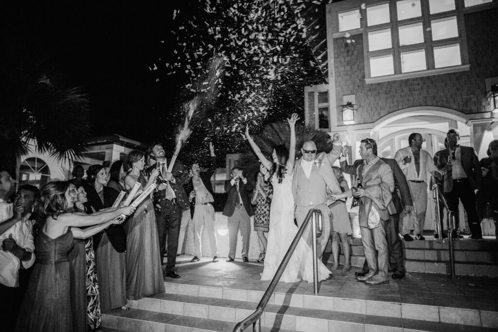 Bride and groom exit the Bald Head Island Club after their wedding ceremony is over.