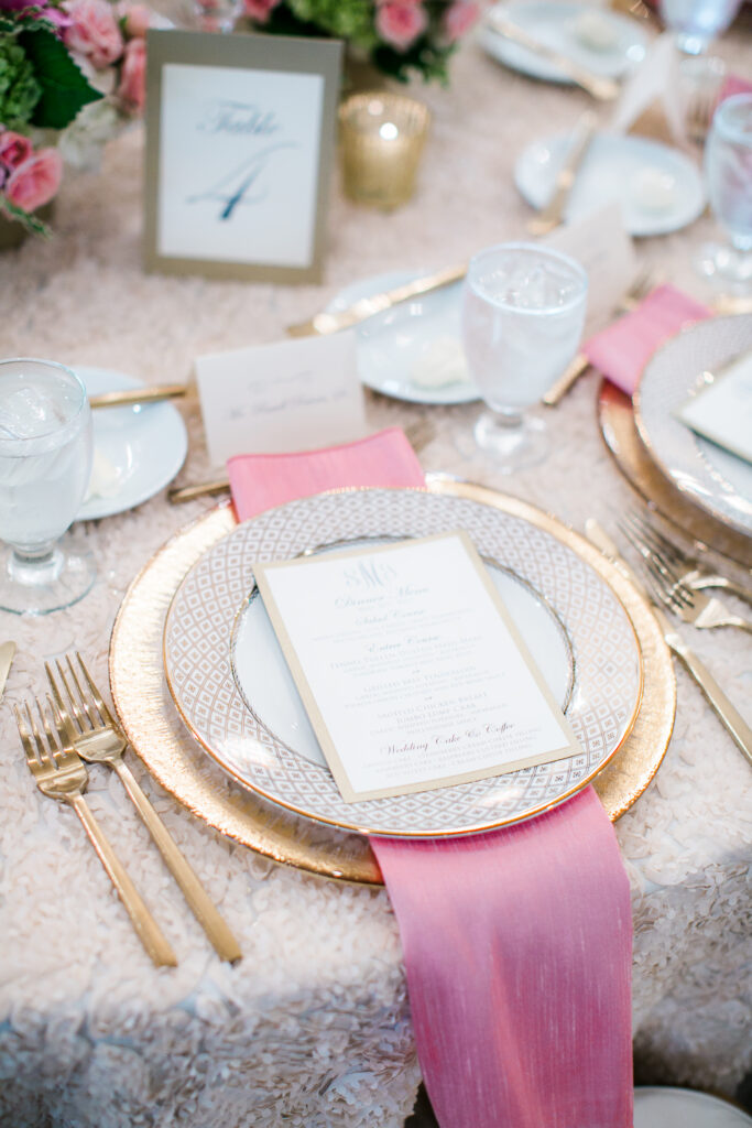 Gold white and pink place setting at a Bald Head Island Wedding.