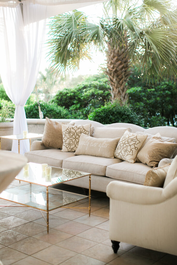 An outdoor couch setting for a wedding at the Bald Head Island Club.