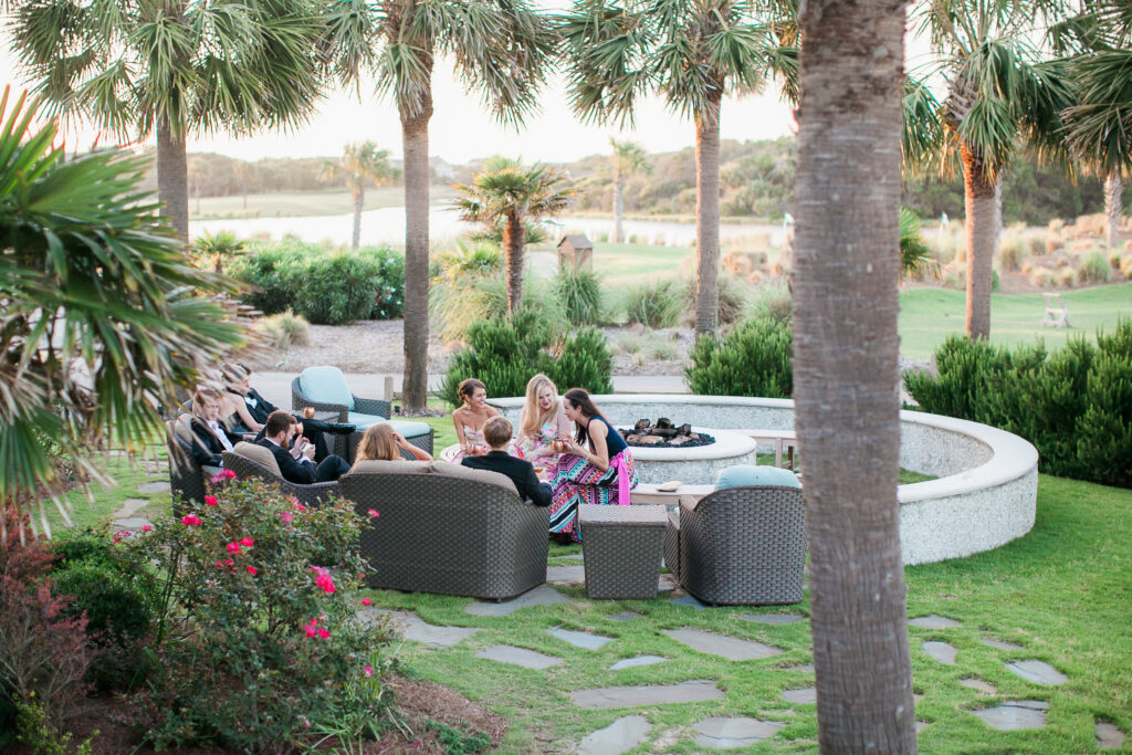 Wedding guests enjoy cocktail hour outside at the Bald Head Island Club.