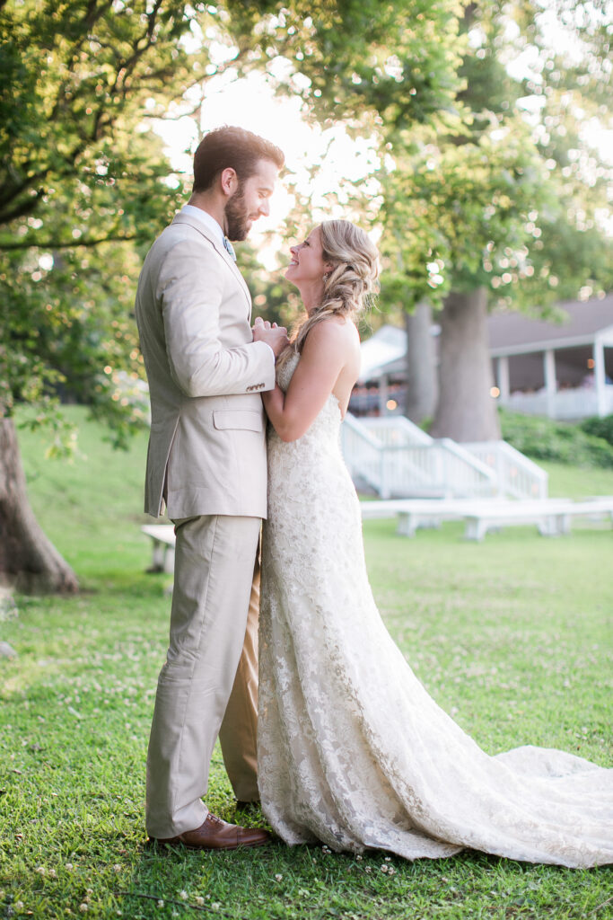 Bride and groom look lovingly at each other.