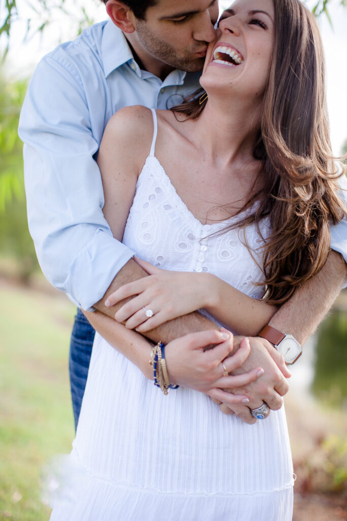 Couple shares a laugh during their wilmington NC engagement session.