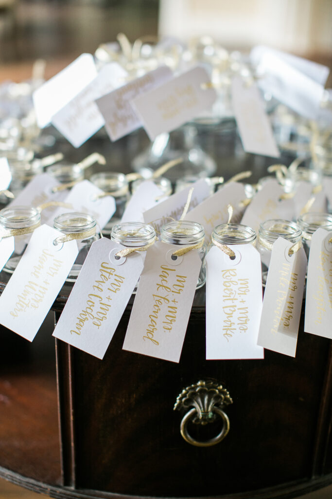 A fun way to tell wedding guests which table they will be sitting at during the reception of their Wilmington NC wedding.