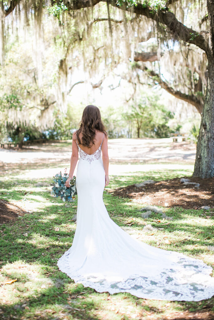 A bride looks away during her bridal portraits in Airlie Gardens.