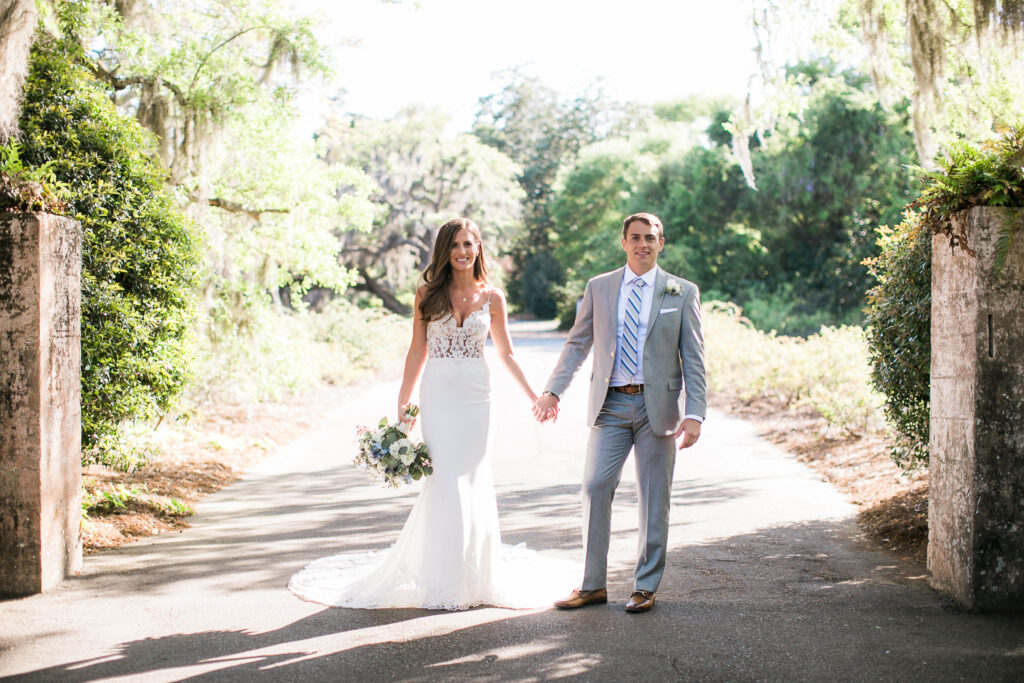 Bride and Groom stand together during their wedding photographs at Airlie Gardens.